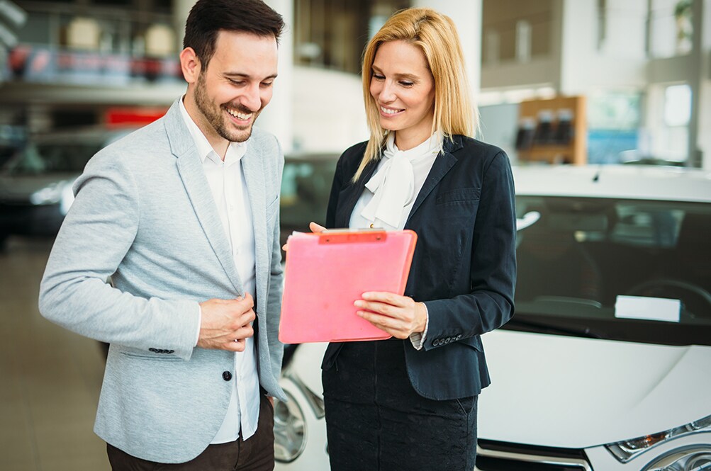 Volvo Cars New Bern is a Car Dealership near Bridgeton NC | Man buying a new car