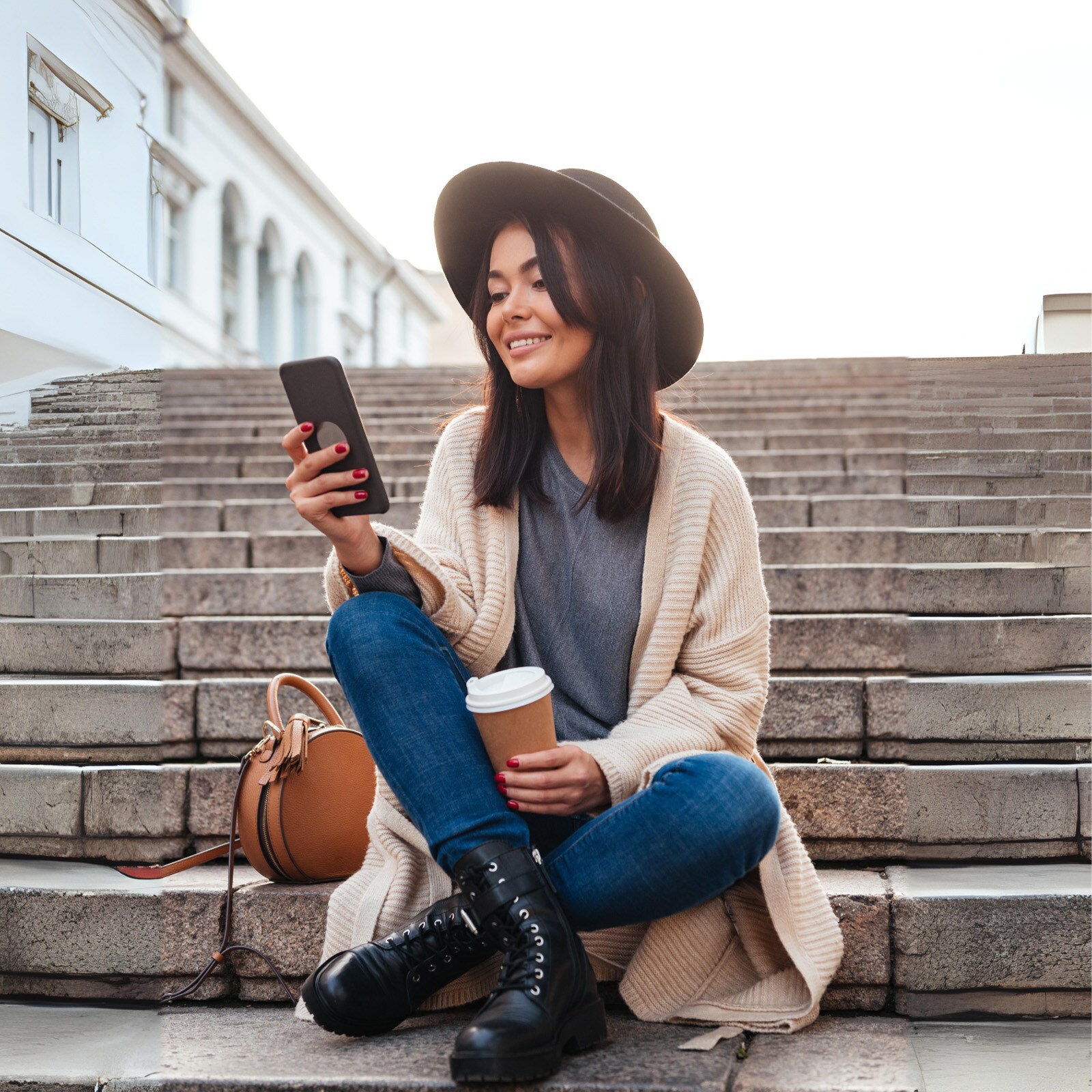 Woman%20Sitting%20On%20Stairs%20On%20Phone%20Texting%20%20Outside.jpg