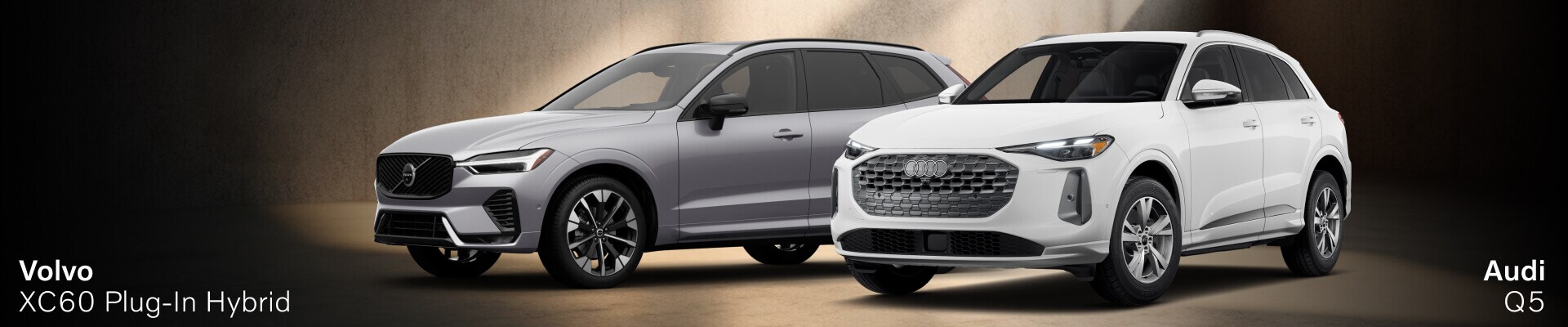 2026 Volvo XC60 Plug-in Hybrid next to the 2025 Audi Q5 Plug-in Hybrid