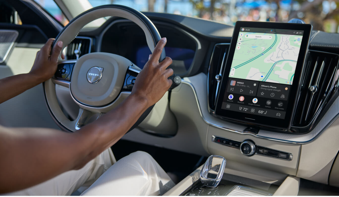 Driver-side interior view of a 2026 Volvo XC60 Ultra focusing on the steering wheel.