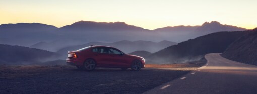 2019 Volvo S60 sedan red mountain background.PNG