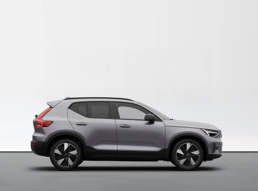 2026 Volvo EX40 Plus in Aurora Silver, side profile in a minimalist studio.