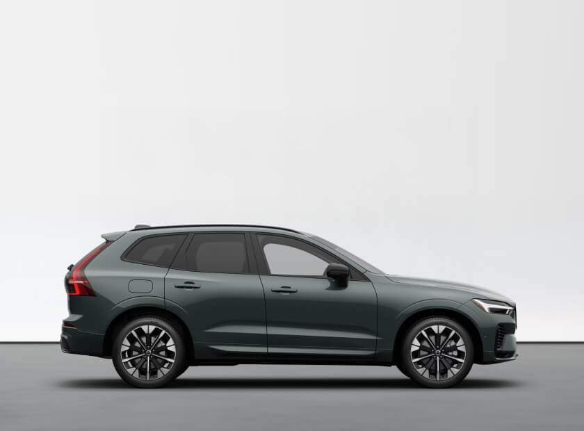 2026 Volvo XC60 Plug-in Hybrid Ultra in Forest Lake, side profile in a minimalist studio.