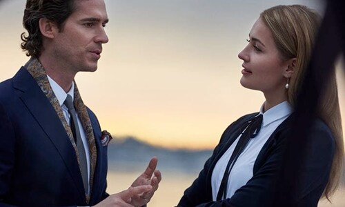 Professional man and woman talking outdoors