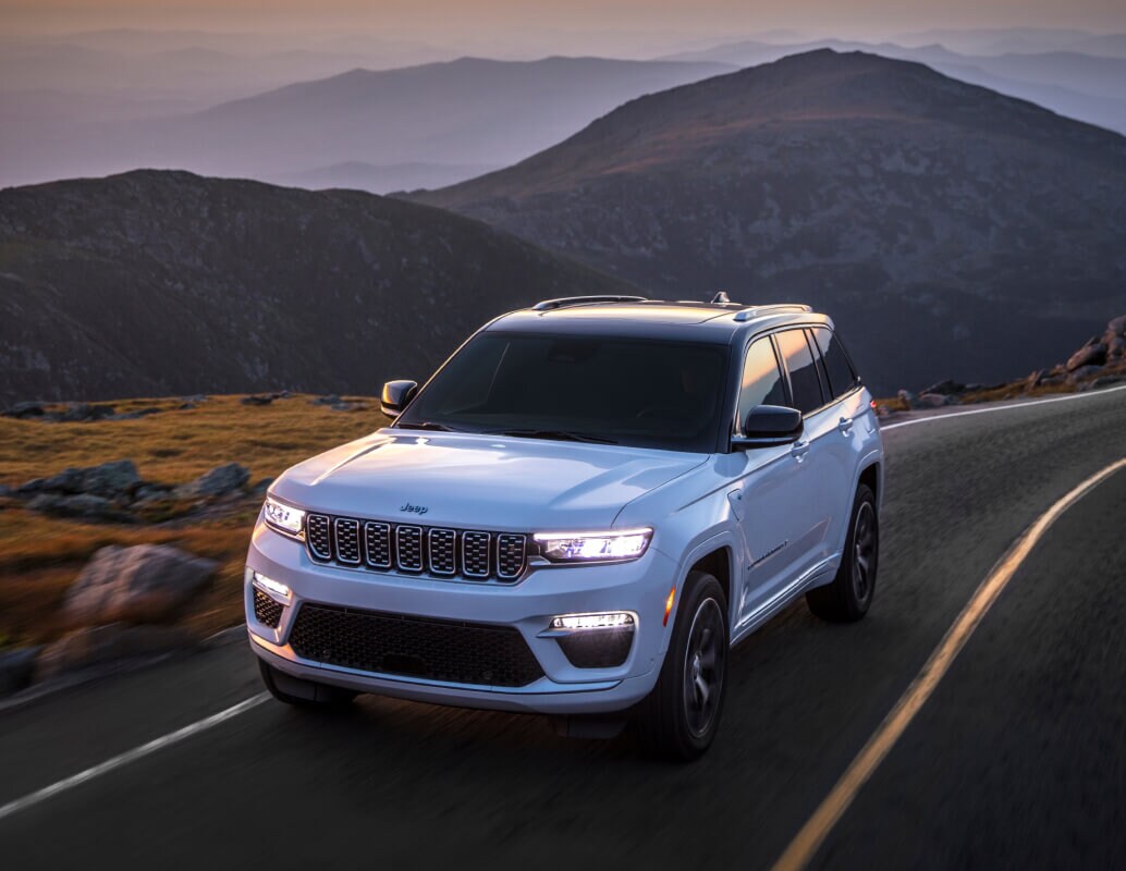 Jeep Grand Cherokee driving through mountain pass