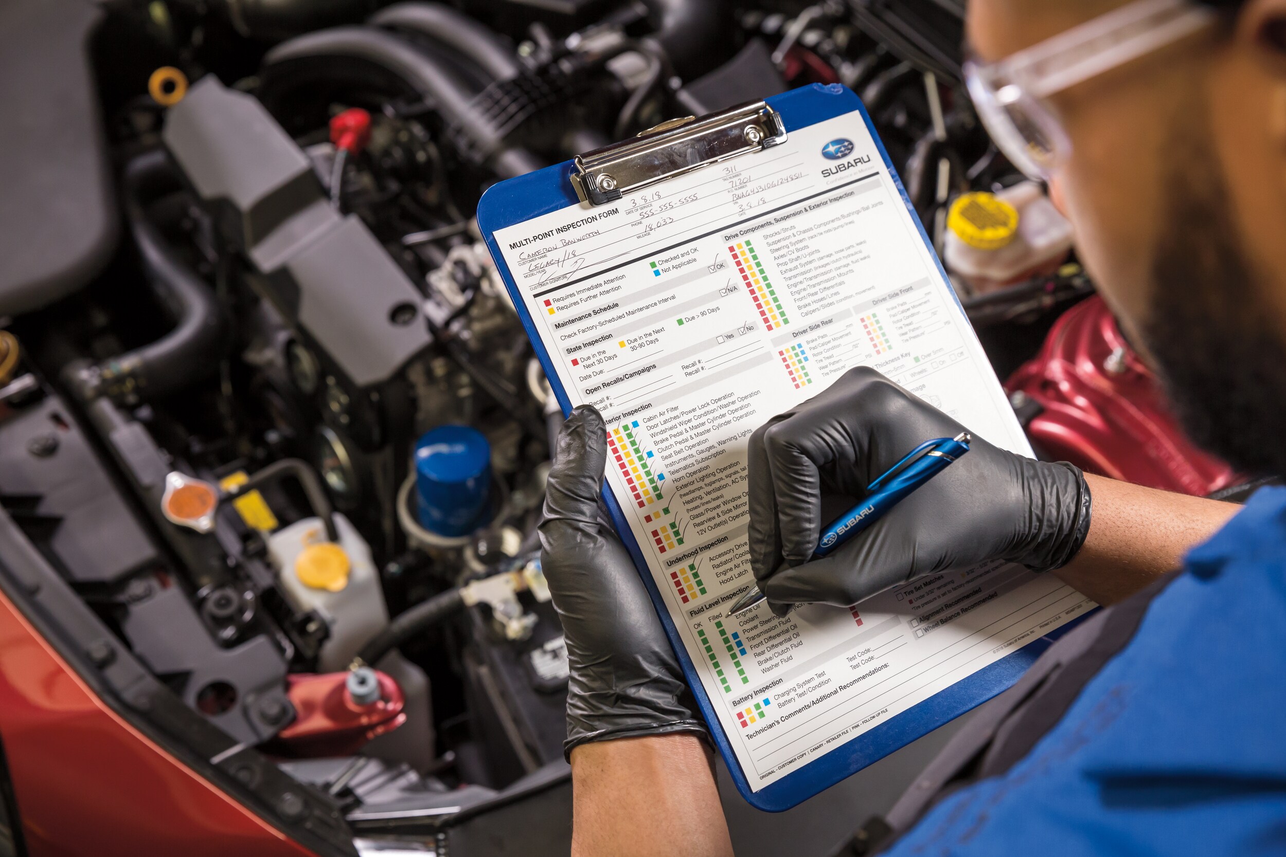 Subaru Technician performing Multi-Point Inspection checklist