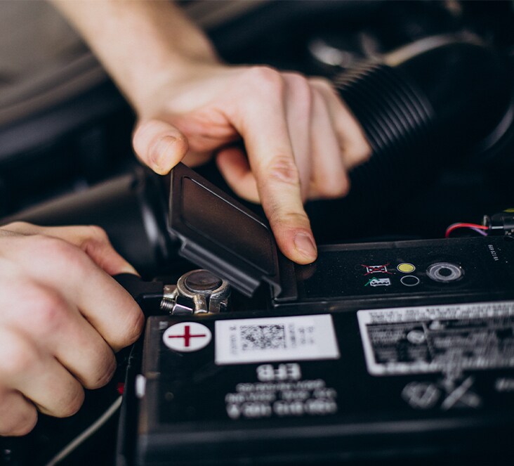 Everything You Need to Know about Your Car Battery at West Broad Hyundai | Close up of positive battery terminal