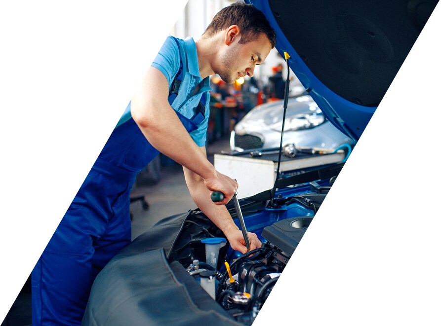 West Broad Hyundai is a Hyundai Dealership in Richmond near Short Pump, VA | Service Advisor Working Under Hood of Vehicle