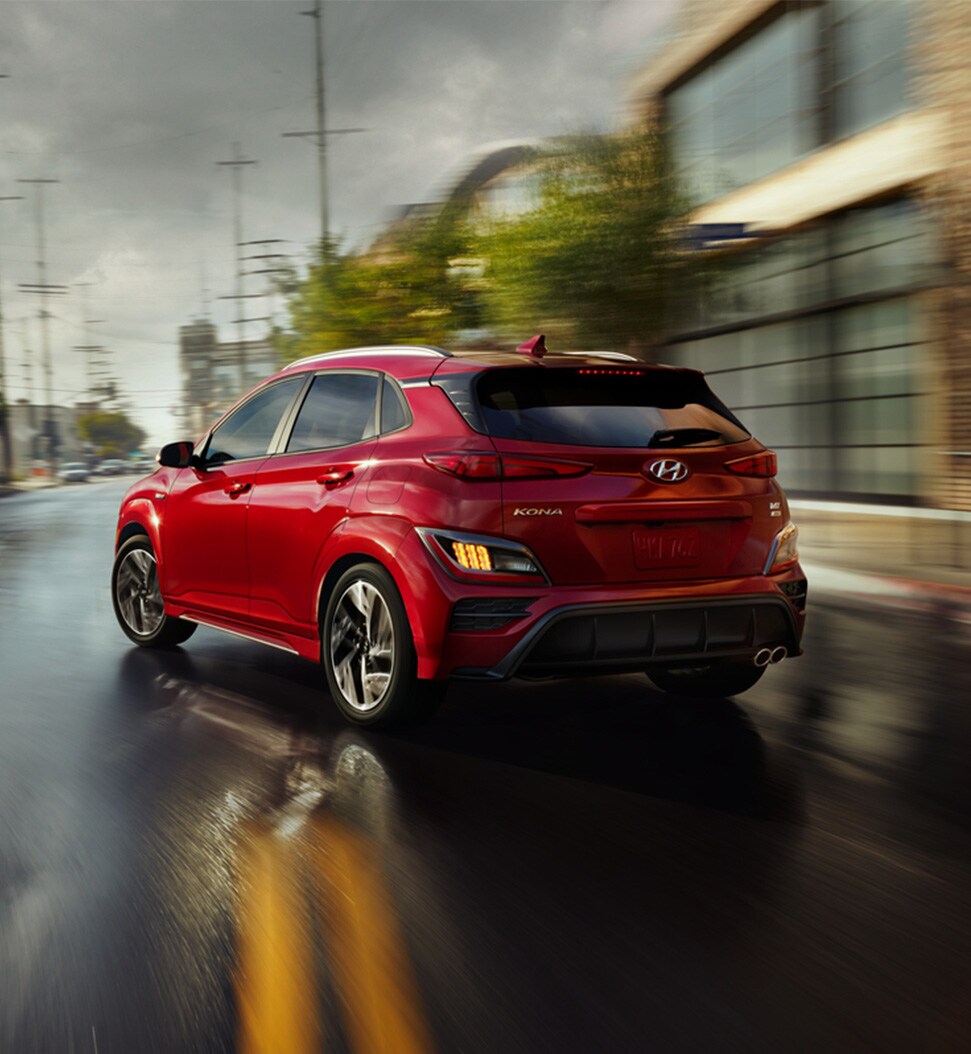 what different tire options are available at West Broad Hyundai in Richmond | Red 2021 Hyundai Kona N-Line Driving on Wet Road After Rainy Weather