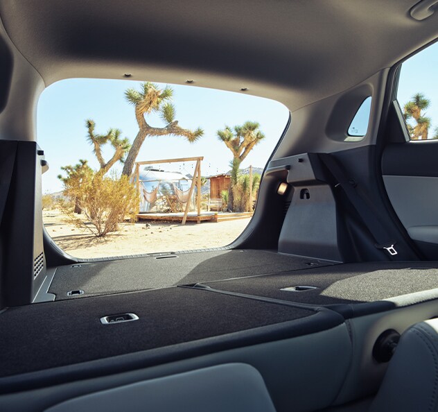 Performance features of the 2022 KONA Electric at West Broad Hyundai of Henrico | back hatch of a 2022 hyundai Kona in Joshua Tree National Park
