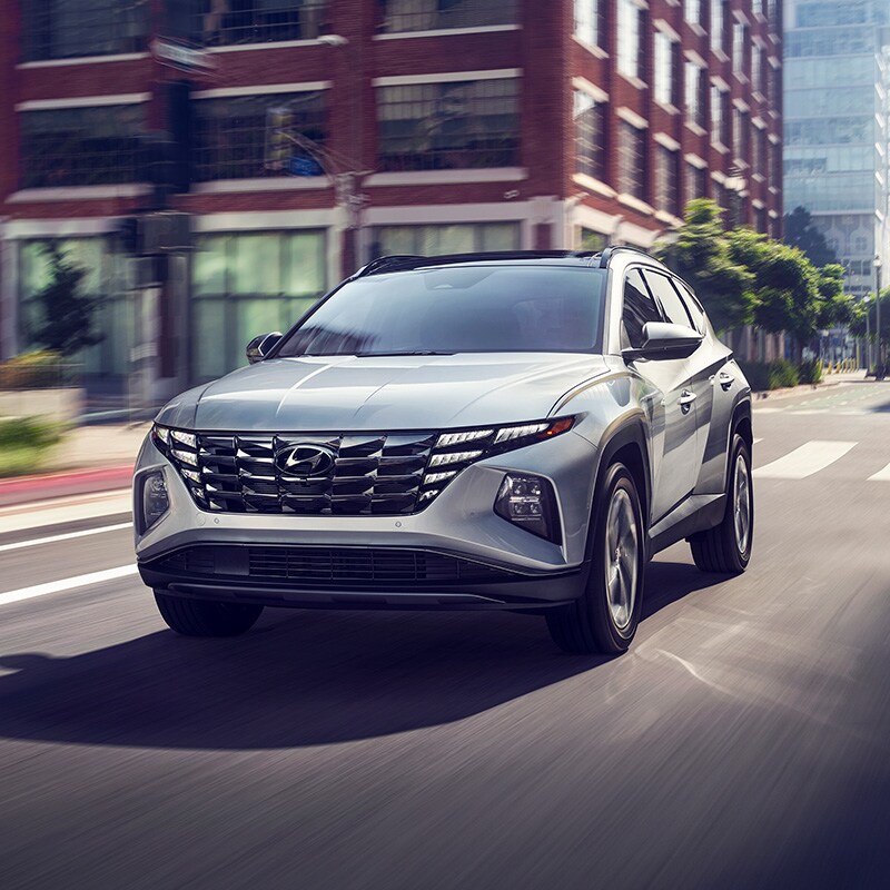 what different tire options are available at West Broad Hyundai in Richmond | Silver 2022 Hyundai Tucson Driving Fast Through City