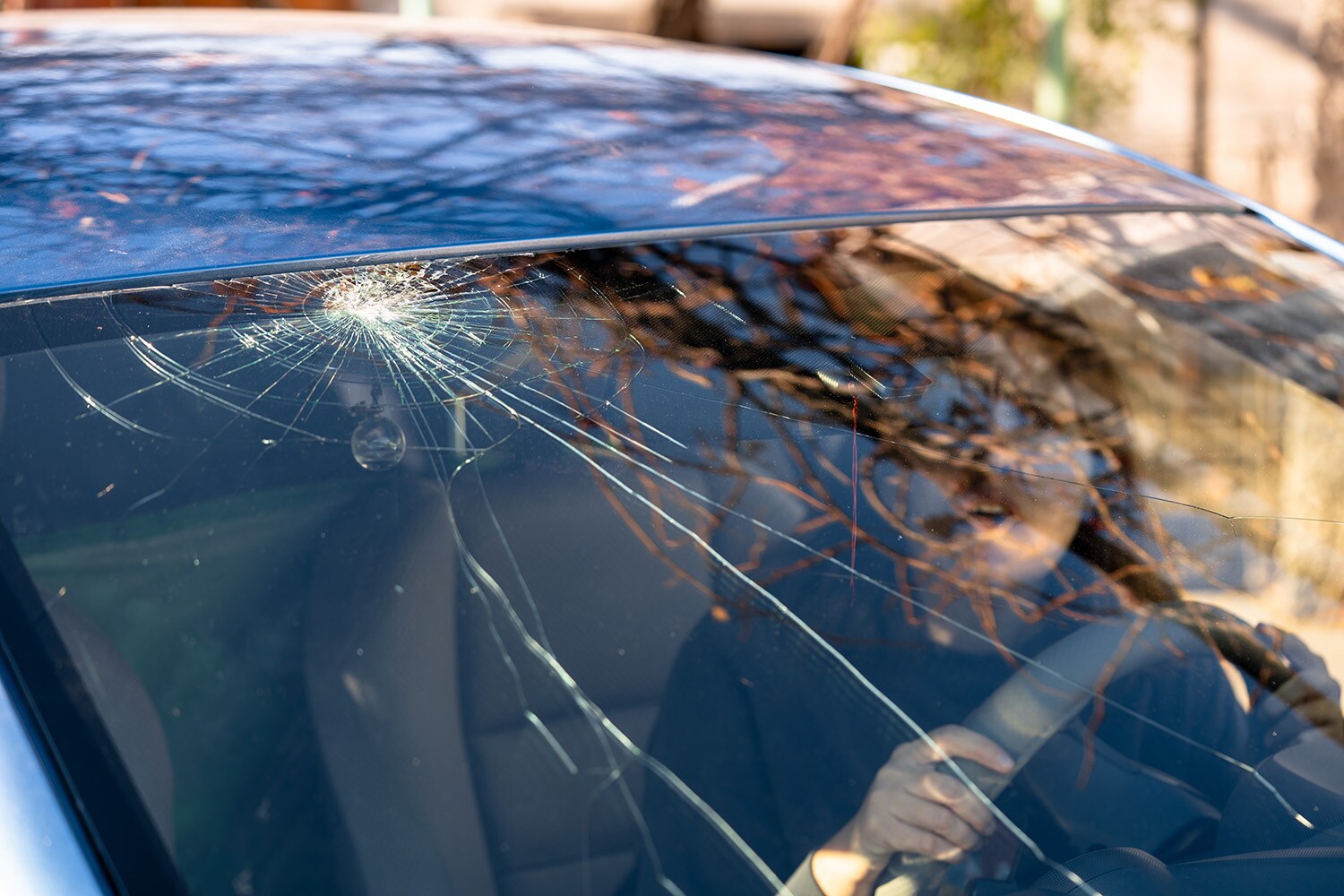 Why You Shouldn't Drive Around with a Chipped Windshield at West Broad Hyundai in Henrico, VA | A woman in the car with a cracked windshield