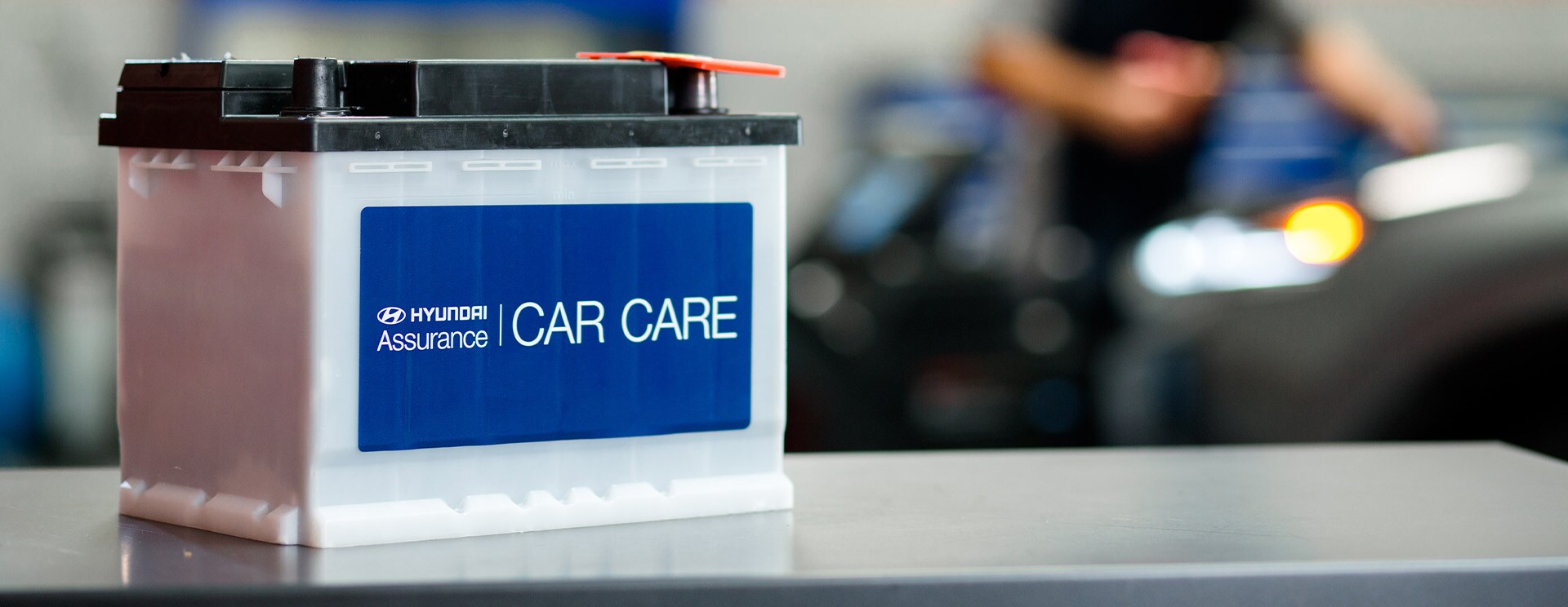 Everything You Need to Know about Your Car Battery at West Broad Hyundai | Hyundai Branded Car Battery Sitting on Table in Service Area