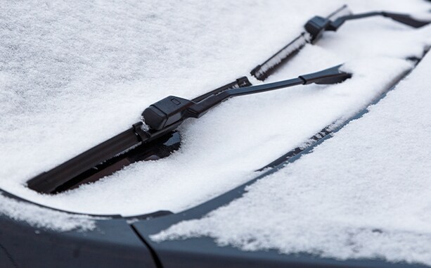 How to prepare your Hyundai for the winter season in Henrico, VA at West Broad Hyundai | Snow on top of car windshield and wiper blades