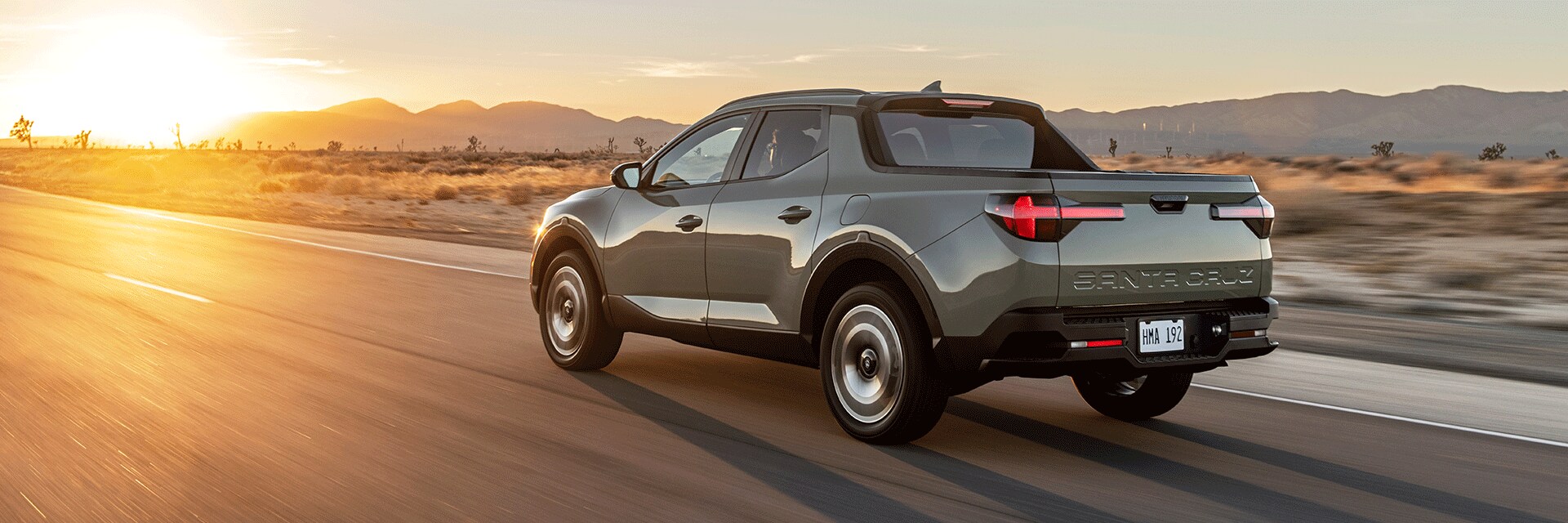 Basic Car Maintenance and Servicing Checklist | West Broad Hyundai | 2022 Hyundai Santa Cruz Facing Left Driving on Road in Desert Towards Sunset