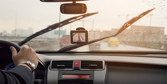 How to Get Your Car Summer Ready at West Broad Hyundai in Henrico, VA | Man driving in the rain with windshield wipers on
