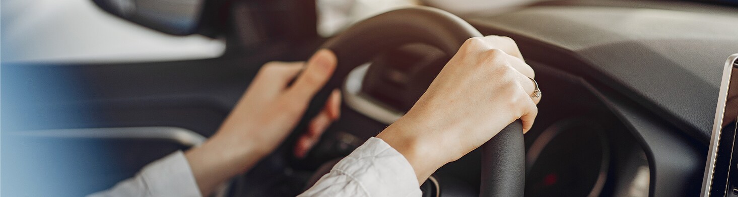 Defining GAP Insurance at West Broad Hyundai in Henrico, VA | Close up of a persons hands on the steering wheel