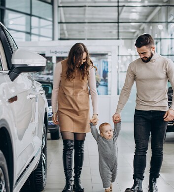 Defining GAP Insurance at West Broad Hyundai in Henrico, VA | Mother and father walking around with their baby inside the dealership