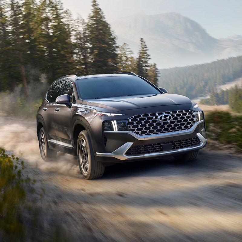what different tire options are available at West Broad Hyundai in Richmond | 2021 Santa Fe Driving on Dirt Trail with Dust Kicking Up Behind it