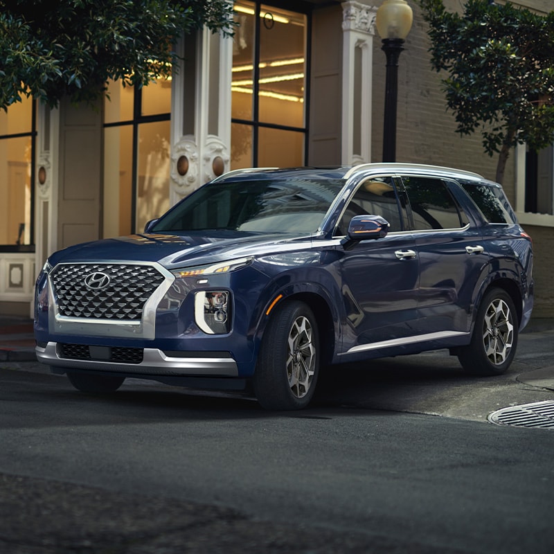 what different tire options are available at West Broad Hyundai in Richmond | Blue 2021 Hyundai Palisade Turning Out of Alleyway in City