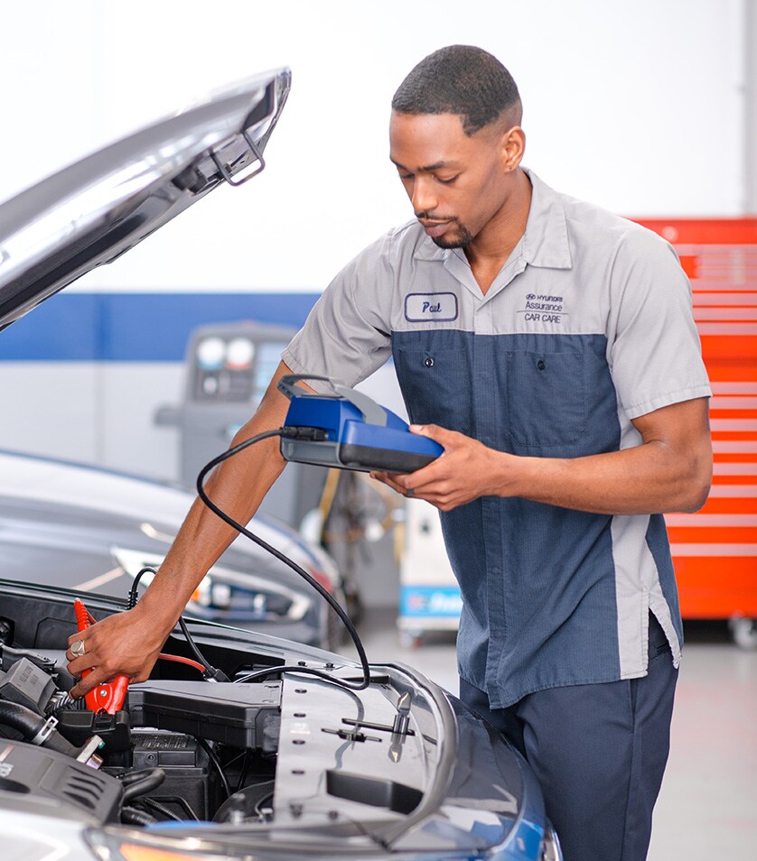 Everything You Need to Know about Your Car Battery at West Broad Hyundai | Hyundai Service Advisor Testing Battery in Hyundai Vehicle