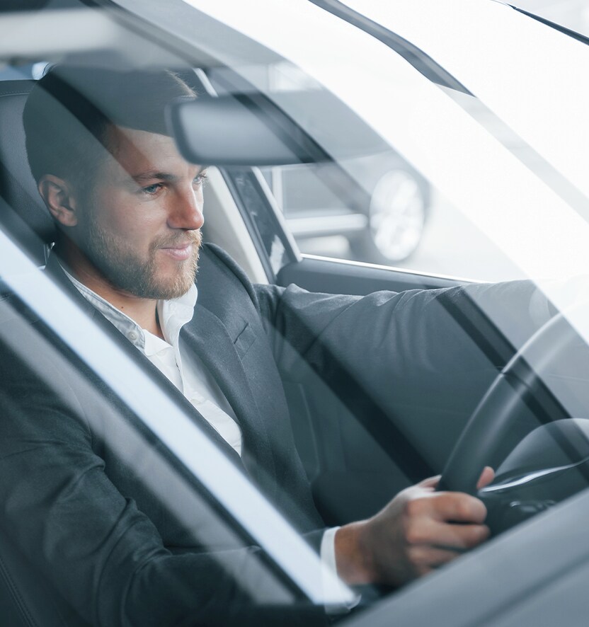 Extend the Life of Your Vehicle at West Broad Hyundai in Henrico, VA | Man in black suit driving his car