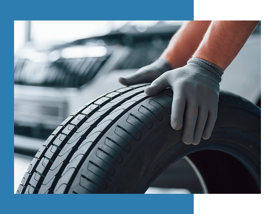 How to check your tires' health at West Broad Hyundai of Henrico | Service Technician Rolling a Tire