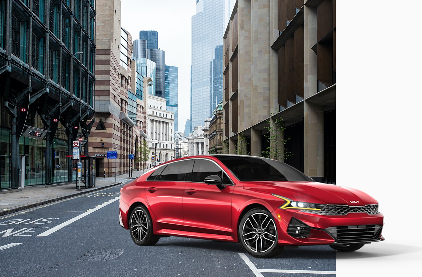 Vehicle Registration Taxes and Fees at West Broad Kia in Henrico, VA | Red 2023 Kia overlapping an image of a city street