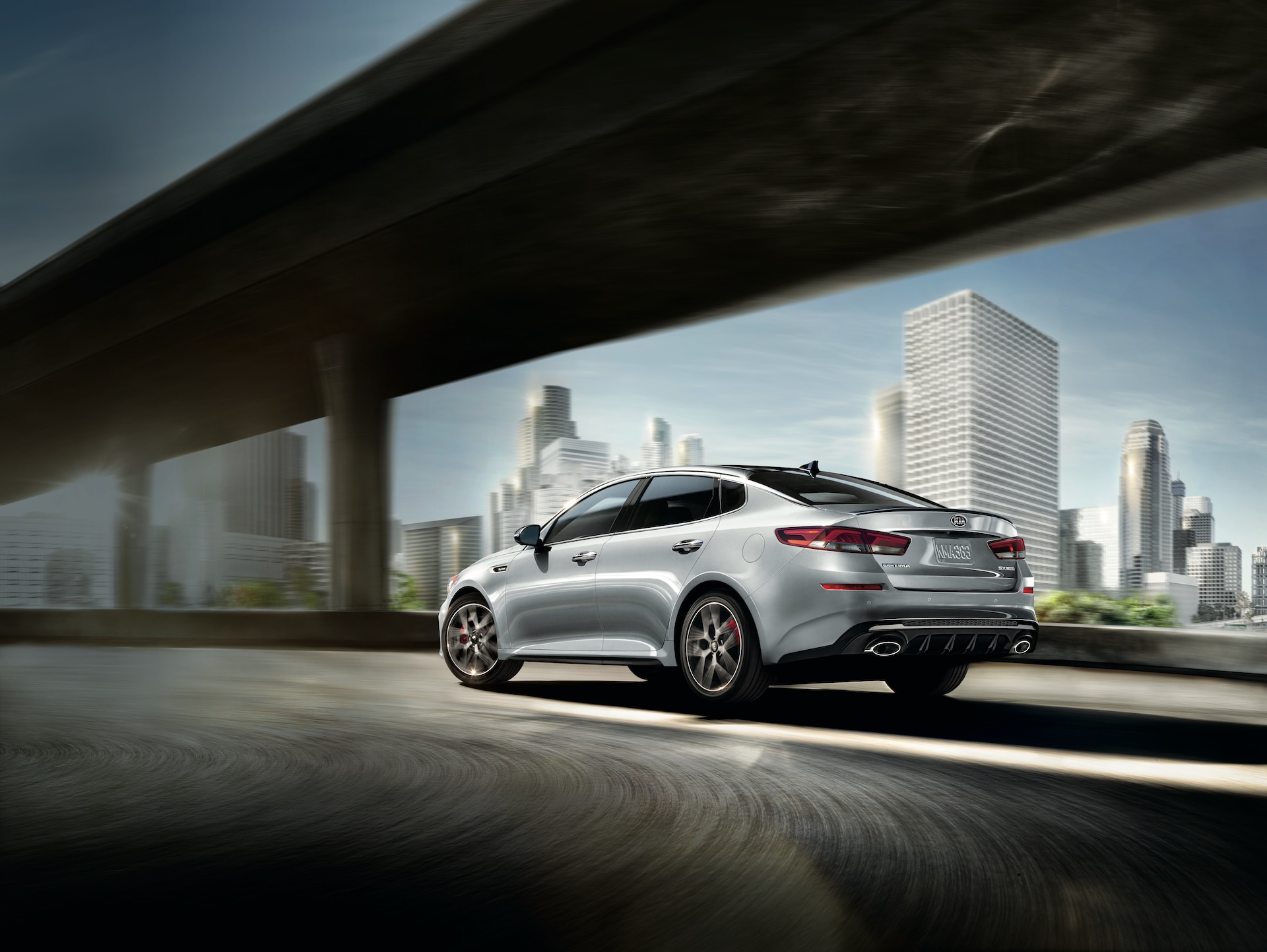 West Broad Kia is a Kia Dealership in Richmond near Charlottesville, VA | 2020 Kia Optima driving in city
