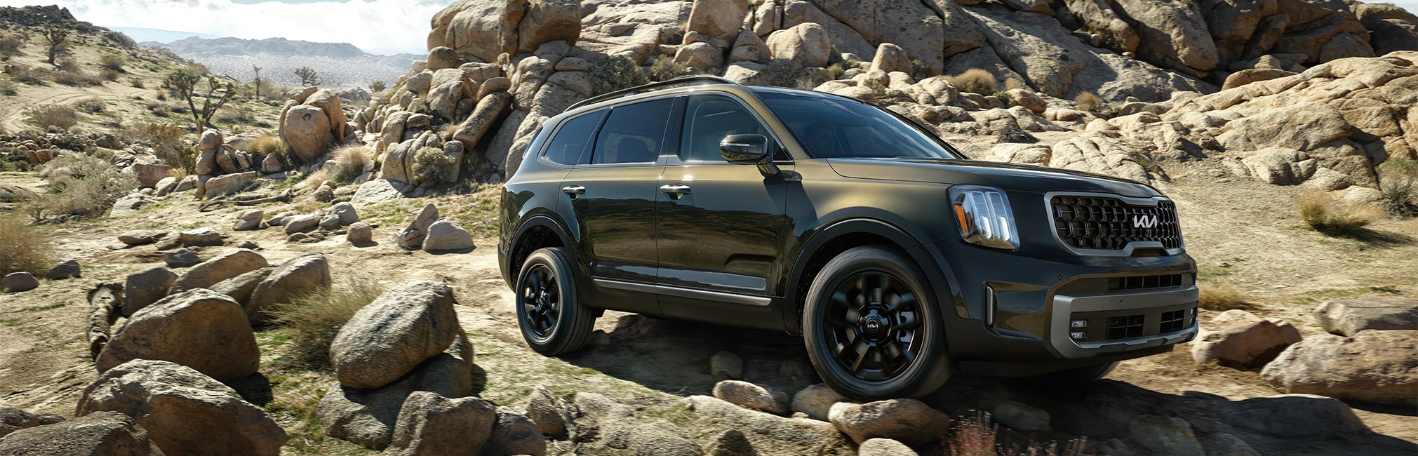 2024 Kia Telluride at West Broad Kia in Henrico, VA | 2024 Kia Telluride driving on top of a rocky road