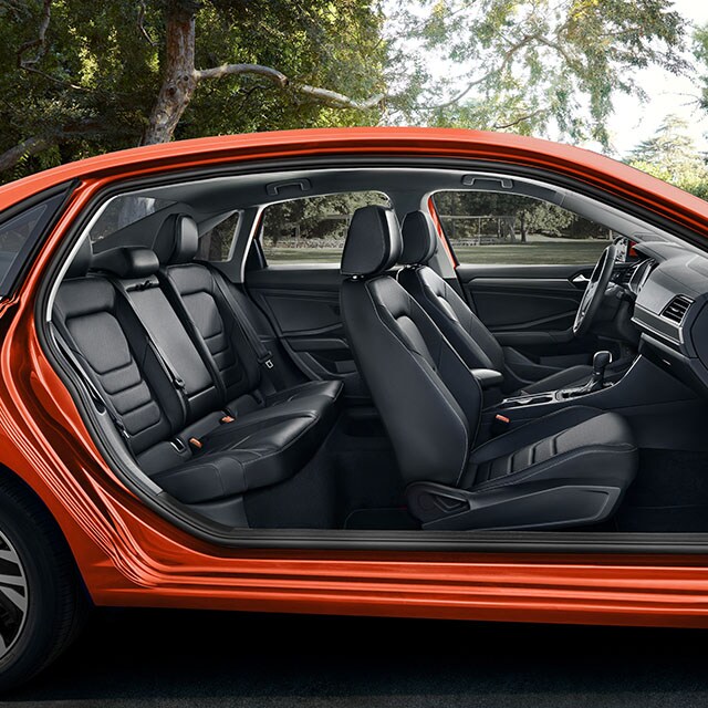 Accessories that help keep your Volkswagen protected at West Broad Volkswagen in Richmond, VA | Full Interior Shot of Orange Volkswagen Jetta with Doors Removed