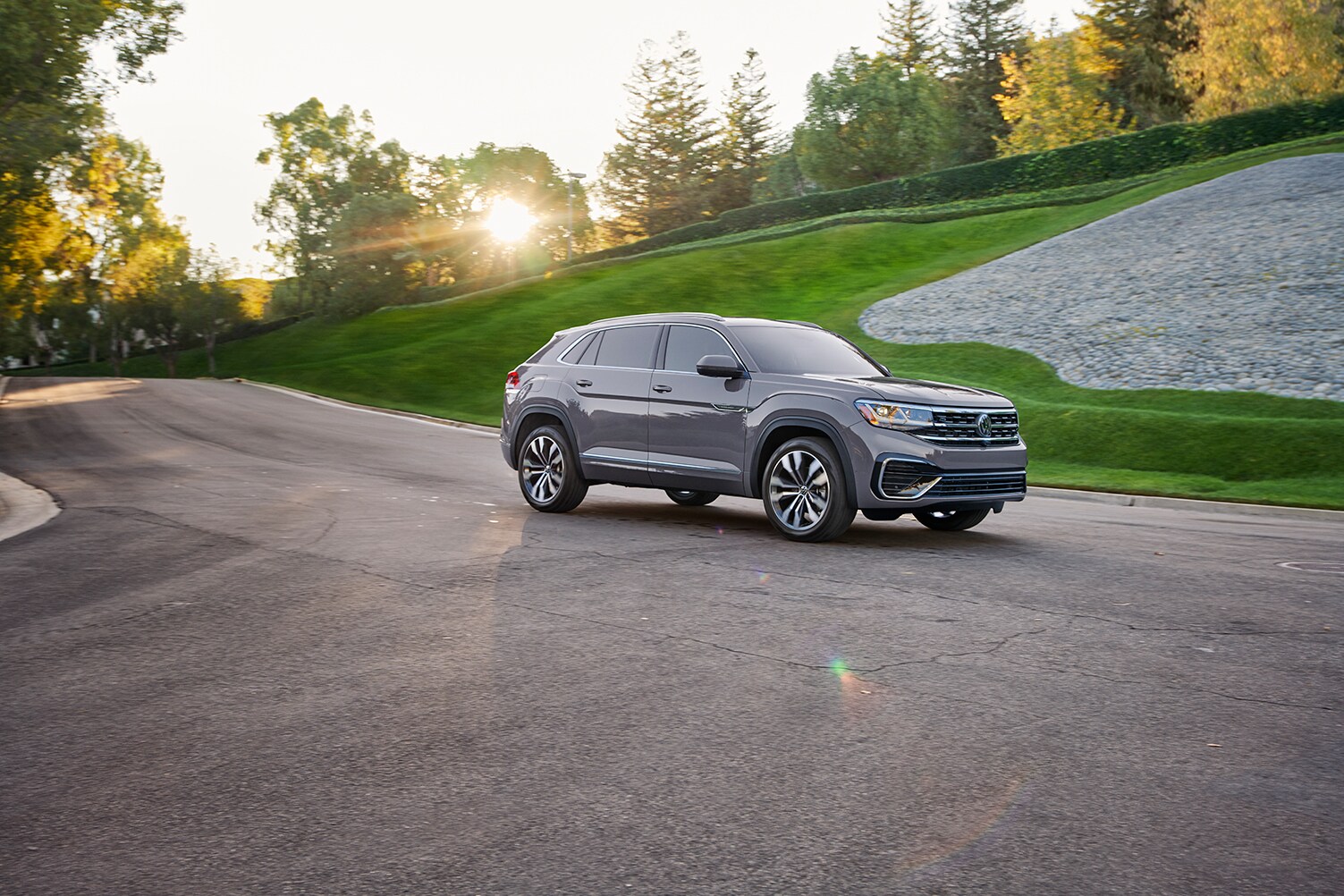 West Broad Volkswagen is a Volkswagen Dealership near Henrico, VA | 2020 Volkswagen Atlas Cross Sport driving on backroad