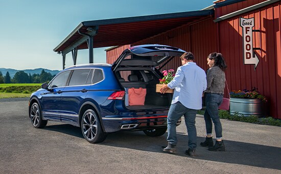 Model Features of the 2021 Volkswagen Tiguan at West Broad VW | Courtney and Max put flowers into trunk