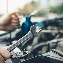 Battery Information at West Broad Volkswagen | Using a wrench for the battery
