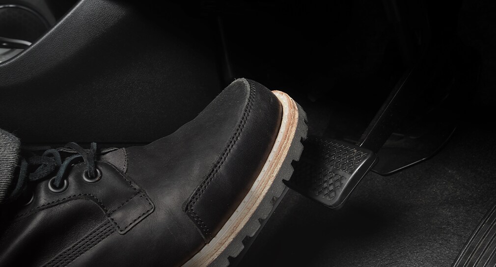 Learn Maintenance Warning Signs at West Broad VW in Richmond, VA | Person with black boots is pressing gas pedal for more acceleration