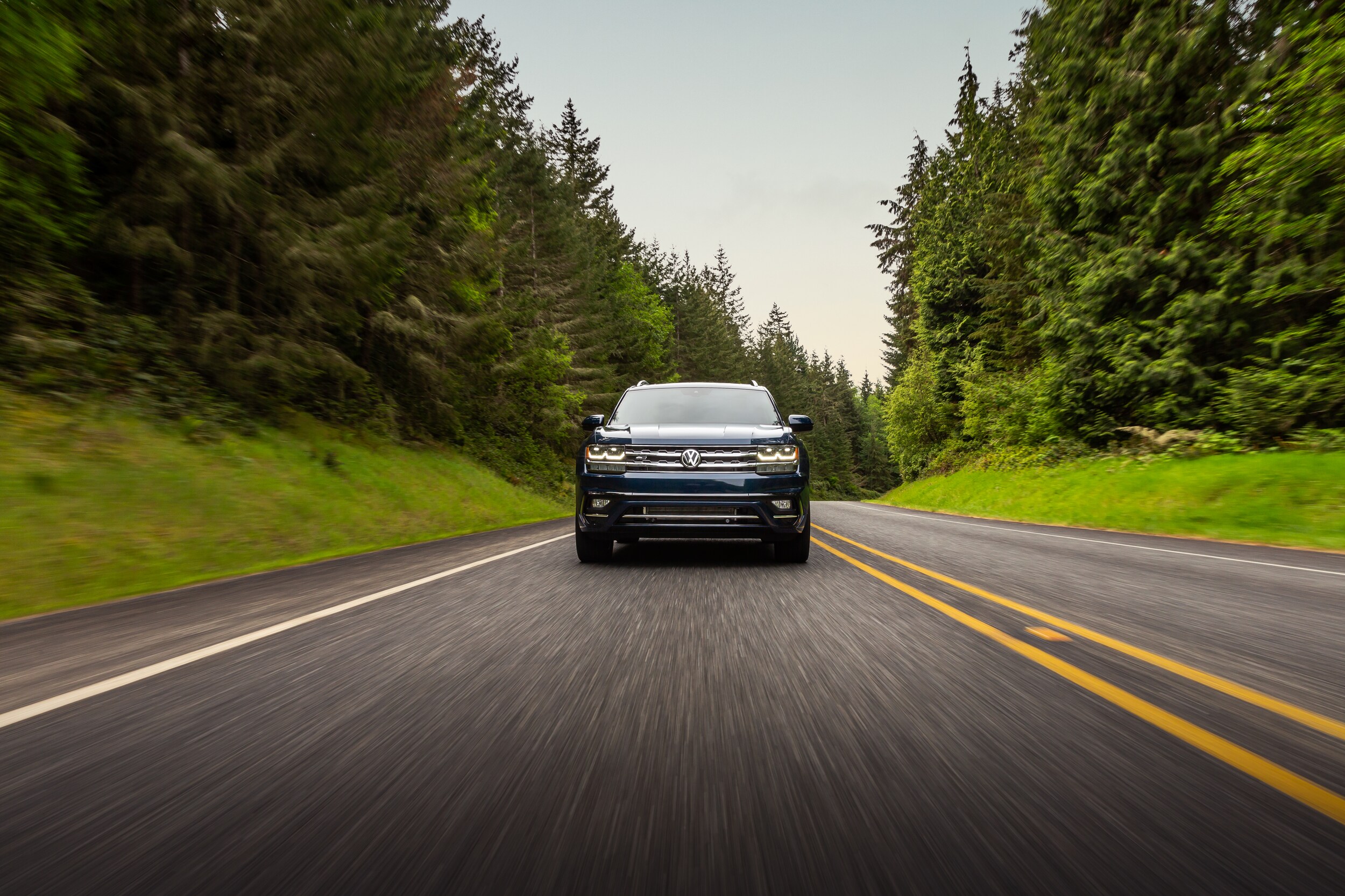 West Broad Volkswagen is a Volkswagen Dealership near Tuckahoe, VA | 2020 Volkswagen Atlas driving on wooded road