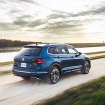 Model Features of the 2021 Volkswagen Tiguan at West Broad VW | Tiguan driving fast on dirt road