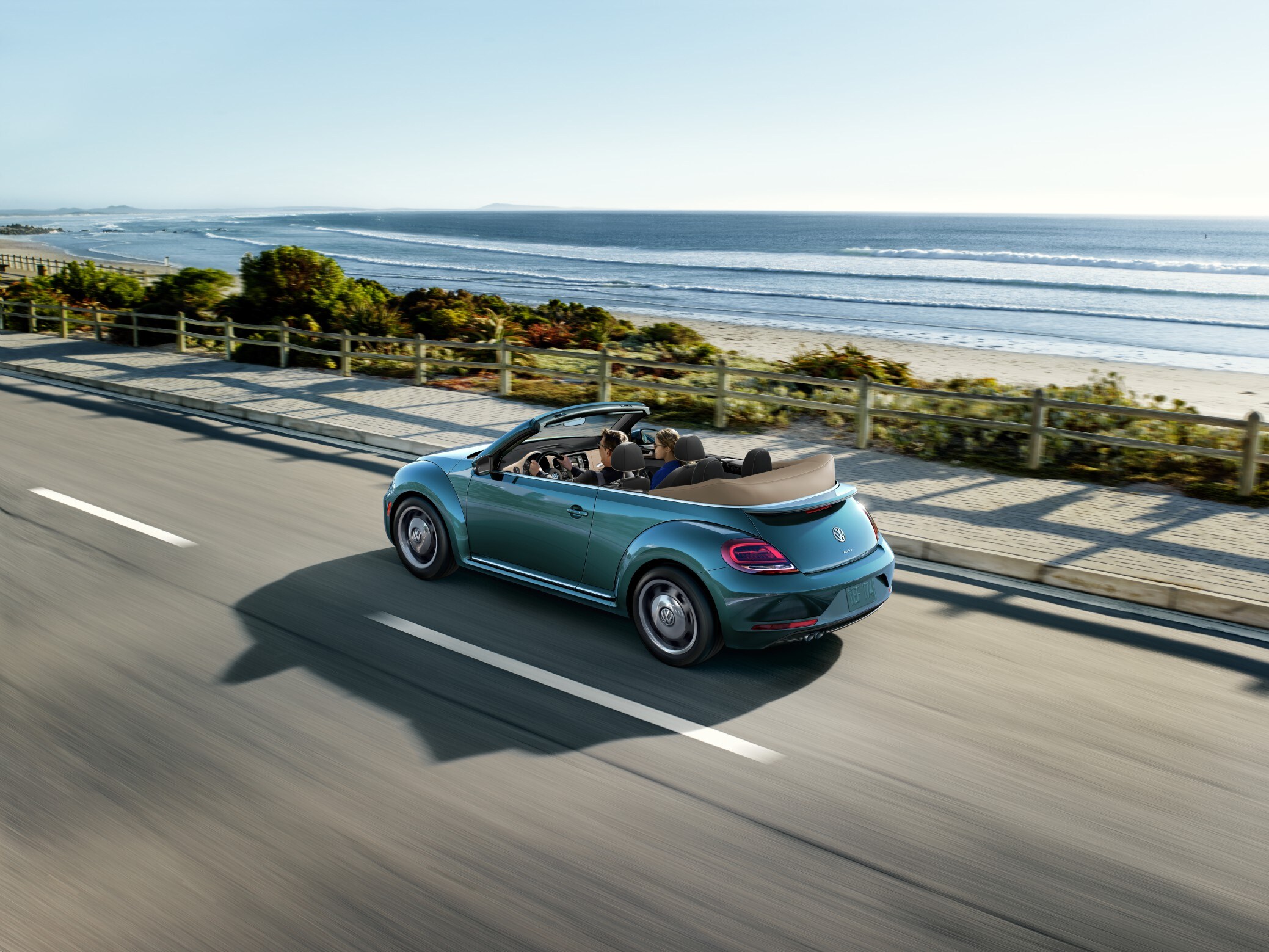 West Broad Volkswagen is a Volkswagen Dealership near Henrico, VA | 2019 Volkswagen Beetle driving on sunny highway