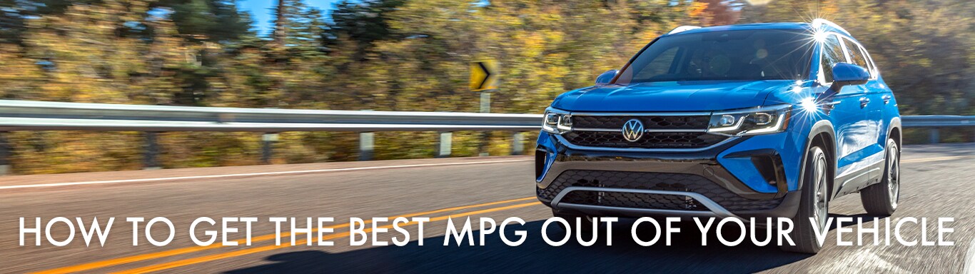 Best MPG At West Broad VW in Richmond, VA | Blue 2023 Volkswagen Taos driving down the road during the day while white text in front of it reads 'How to Get the Best MPG Out of Your Vehicle'
