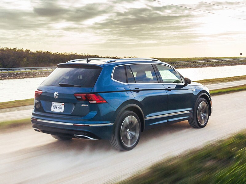 What Different Tire Options are Available at West Broad Volkswagen in Richmond | 2021 Volkswagen Tiguan Driving on Dirt Road Past Water