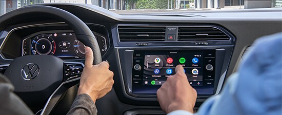 Model Features of the 2021 Volkswagen Tiguan at West Broad VW | Max uses touch screen as Courtney drives