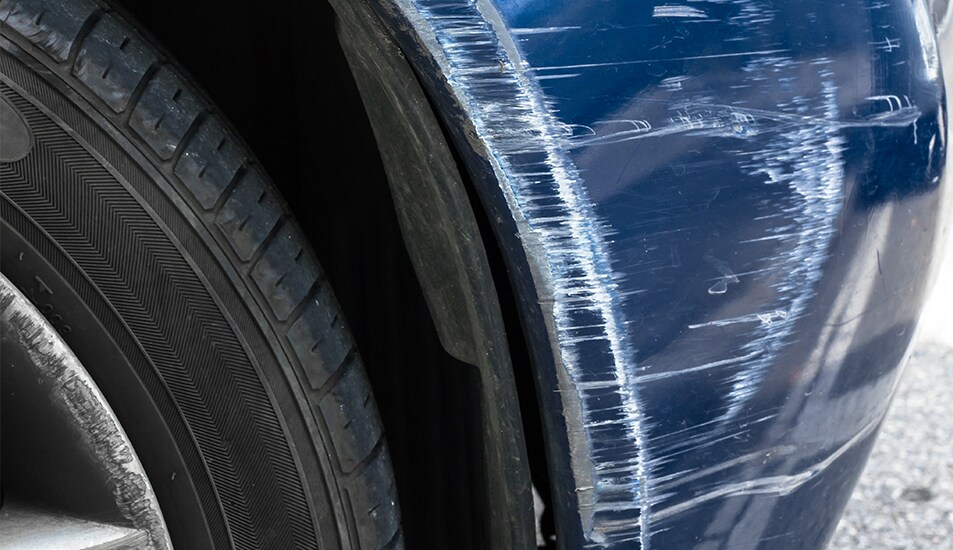 What is Paintless Dent Repair? | West Broad VW | Blue car with paint scratch on front bumper