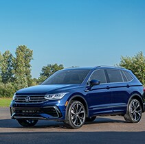 Model Features of the 2021 Volkswagen Tiguan at West Broad VW | Front left of Tiguan parked in sunlight
