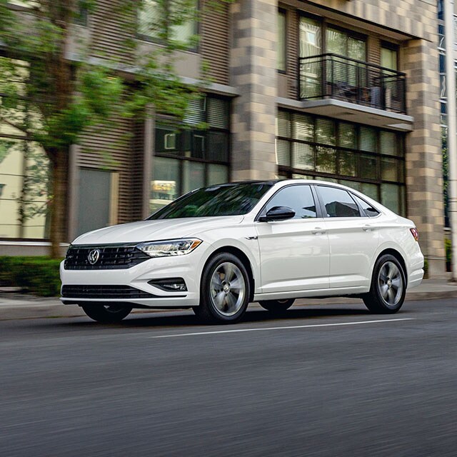 Accessories that help keep your Volkswagen protected at West Broad Volkswagen in Richmond, VA | White Volkswagen Jetta Driving through City