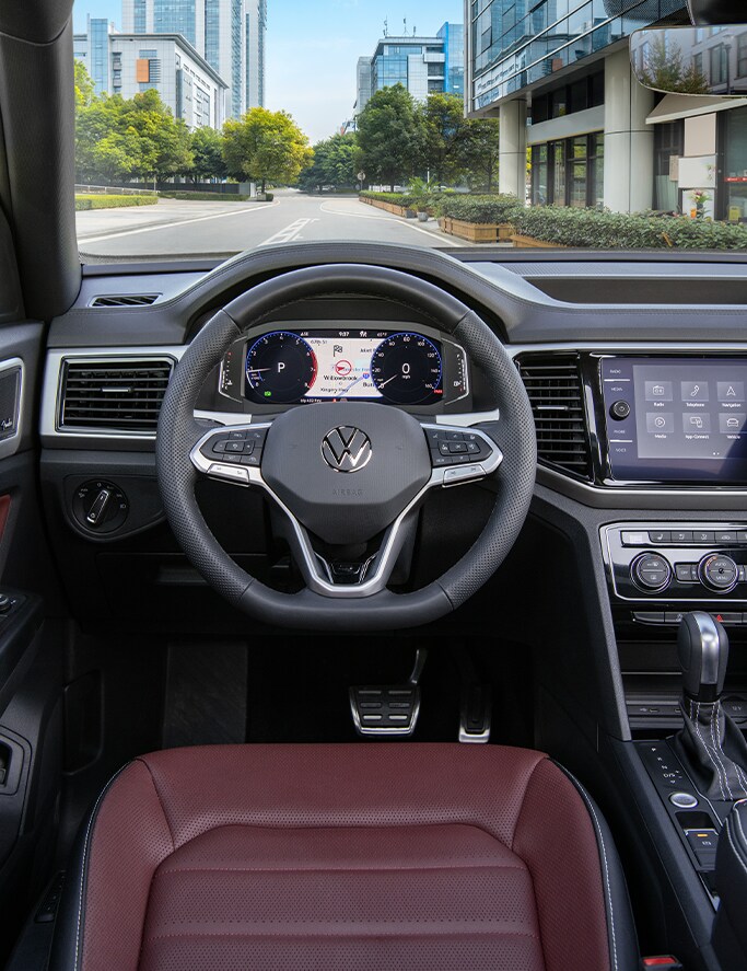 Model Features of the 2022 Volkswagen Atlas at West Broad Volkswagen | Black and silver interior of a Volkswagen Atlas showcasing the digital display and driving seat