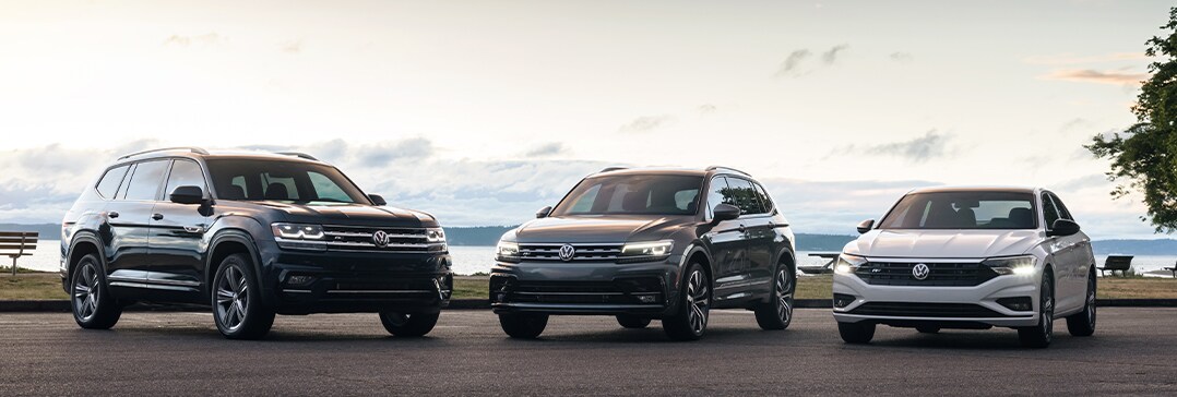 Battery Information at West Broad Volkswagen | Three Volkswagens parked at park with water behind them