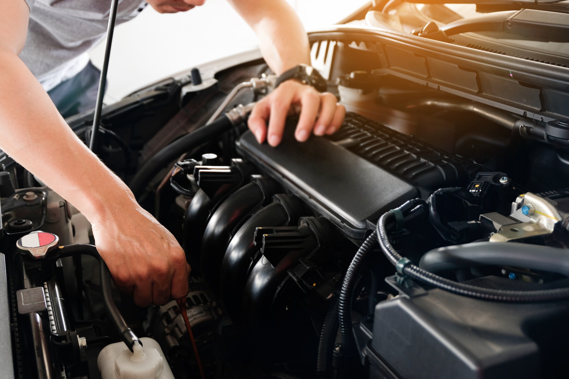 Mechanic repairing transmission.