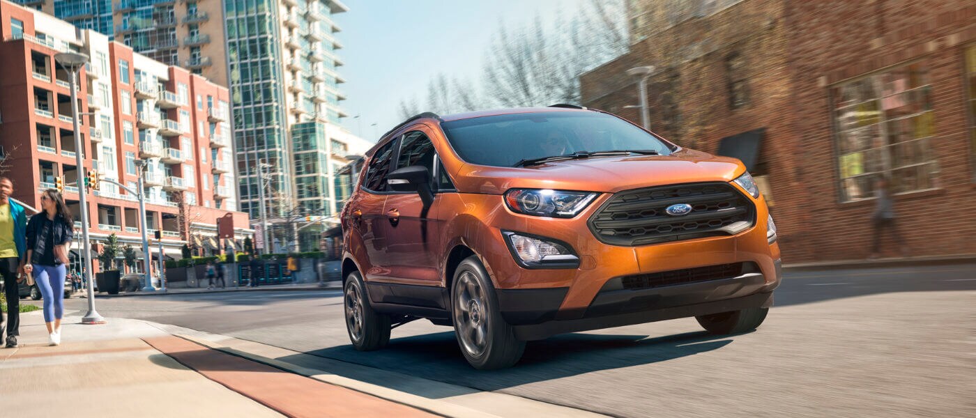 2019 Orange Ford EcoSport Driving Downtown