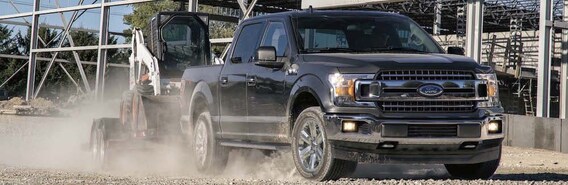 Black 2019 Ford F-150 Towing Construction Equipment