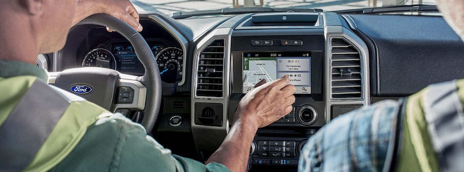 Ford SYNC Infotainment System Two construction workers using their Ford SYNC